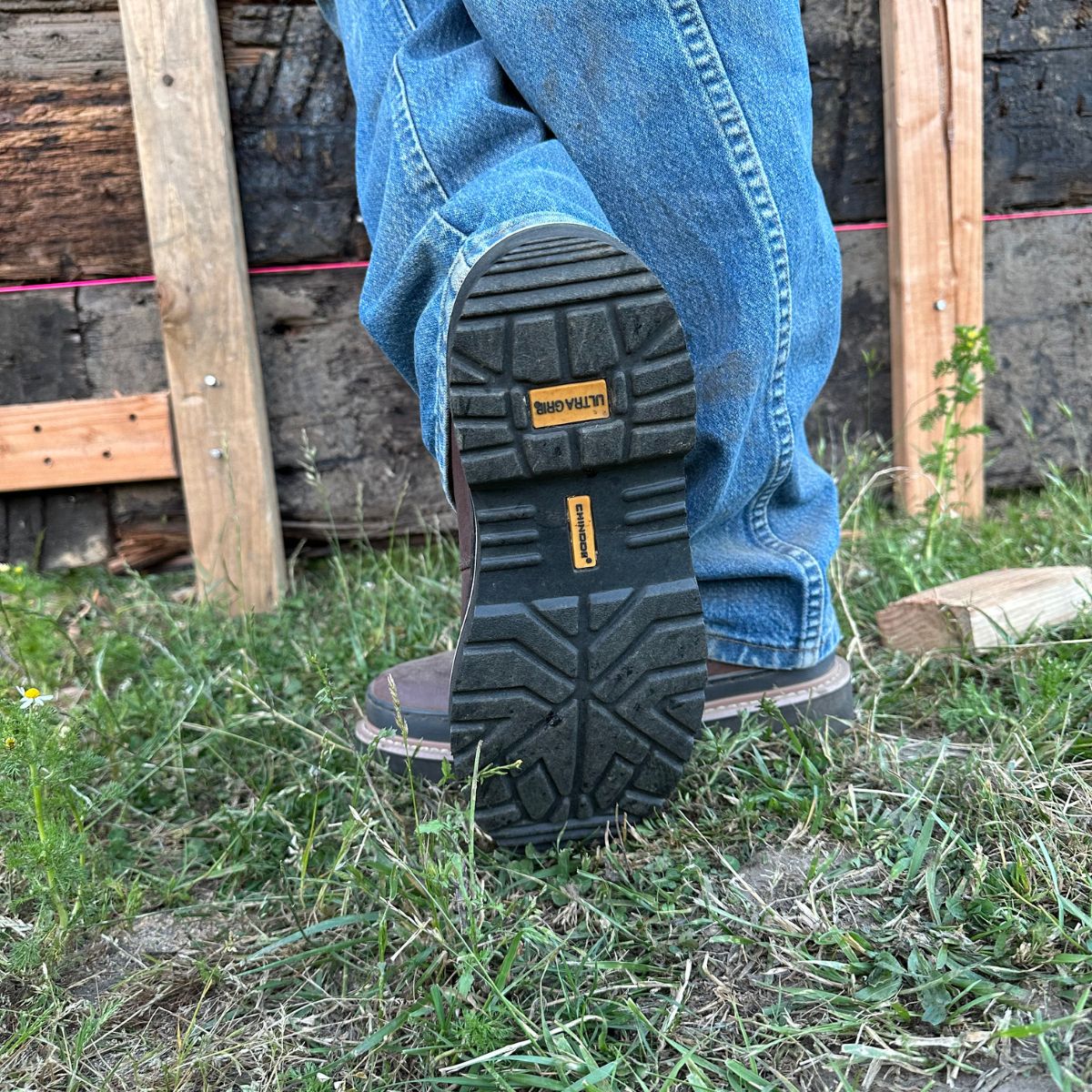 A man wearing Workhorse Romeo Men’s Light Duty Boots in Brown shows the rugged tread of the outsole, highlighting the durable, slip-resistant design, ideal for light-duty tasks and outdoor work.