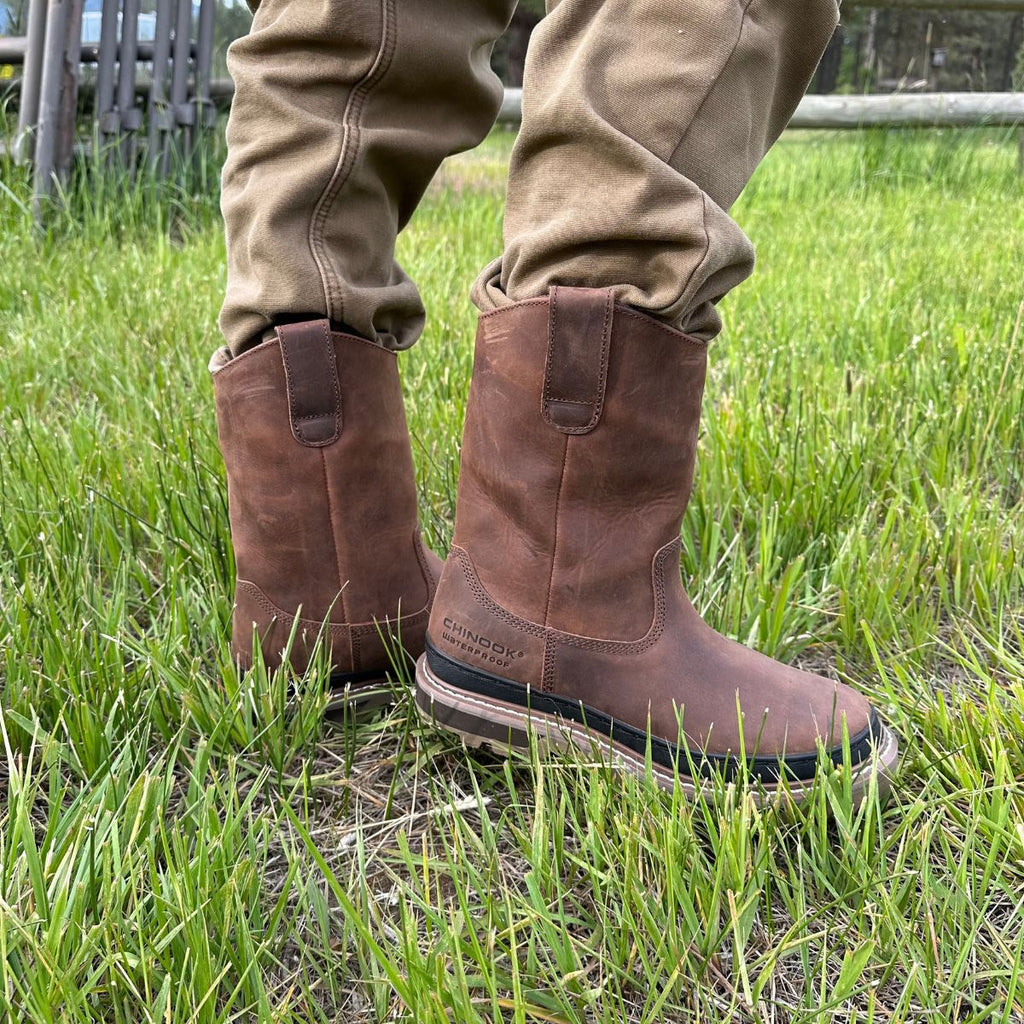 Rancher 11” Soft Toe Men’s Waterproof Work Boot in Brown, showcasing its tough leather exterior, reinforced stitching, and a rugged outsole designed for durability and traction, perfect for all types of work in demanding environments.